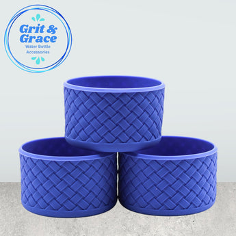 Set of three dark blue tumblers on countertop