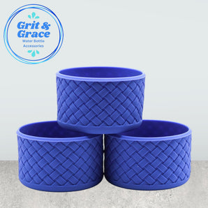 Set of three dark blue tumblers on countertop